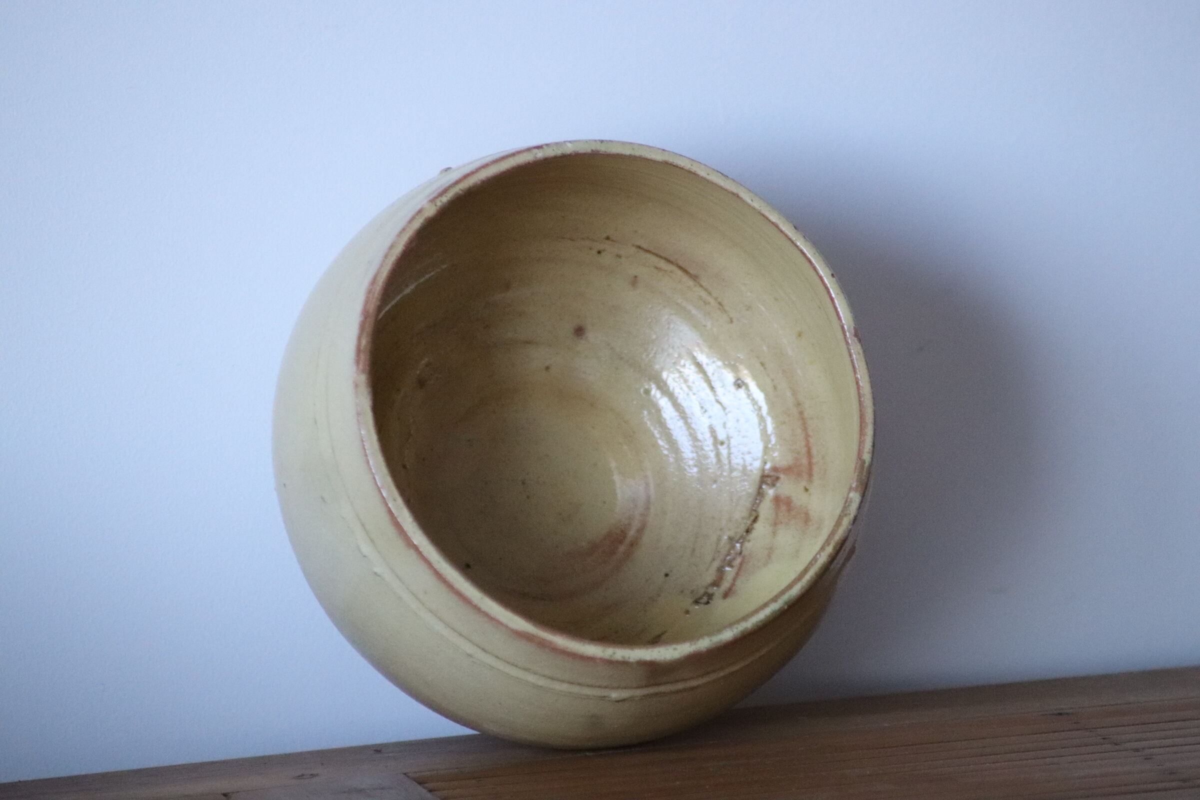 Ball vase in pale yellow glazed sandstone