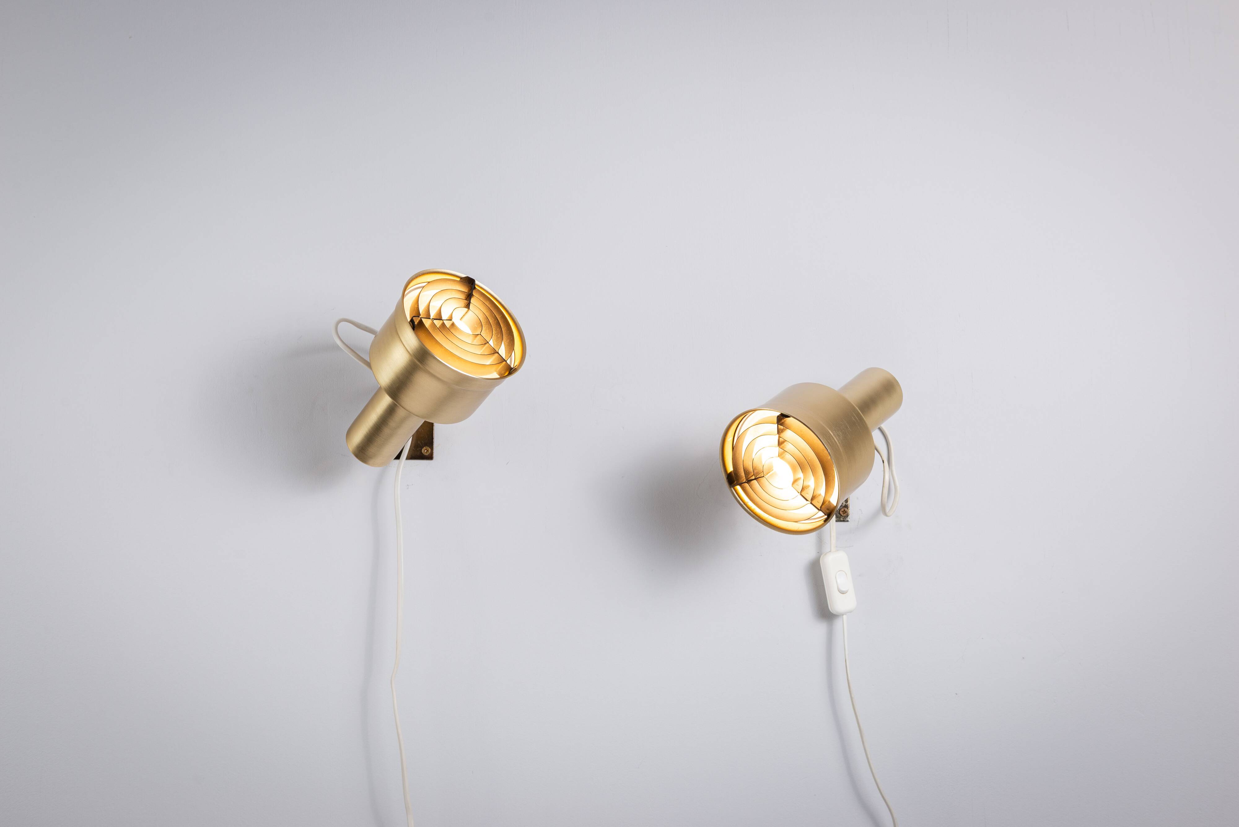 Pair of adjustable wall lamps designed by Per Sundstedt for Kosta Lampan