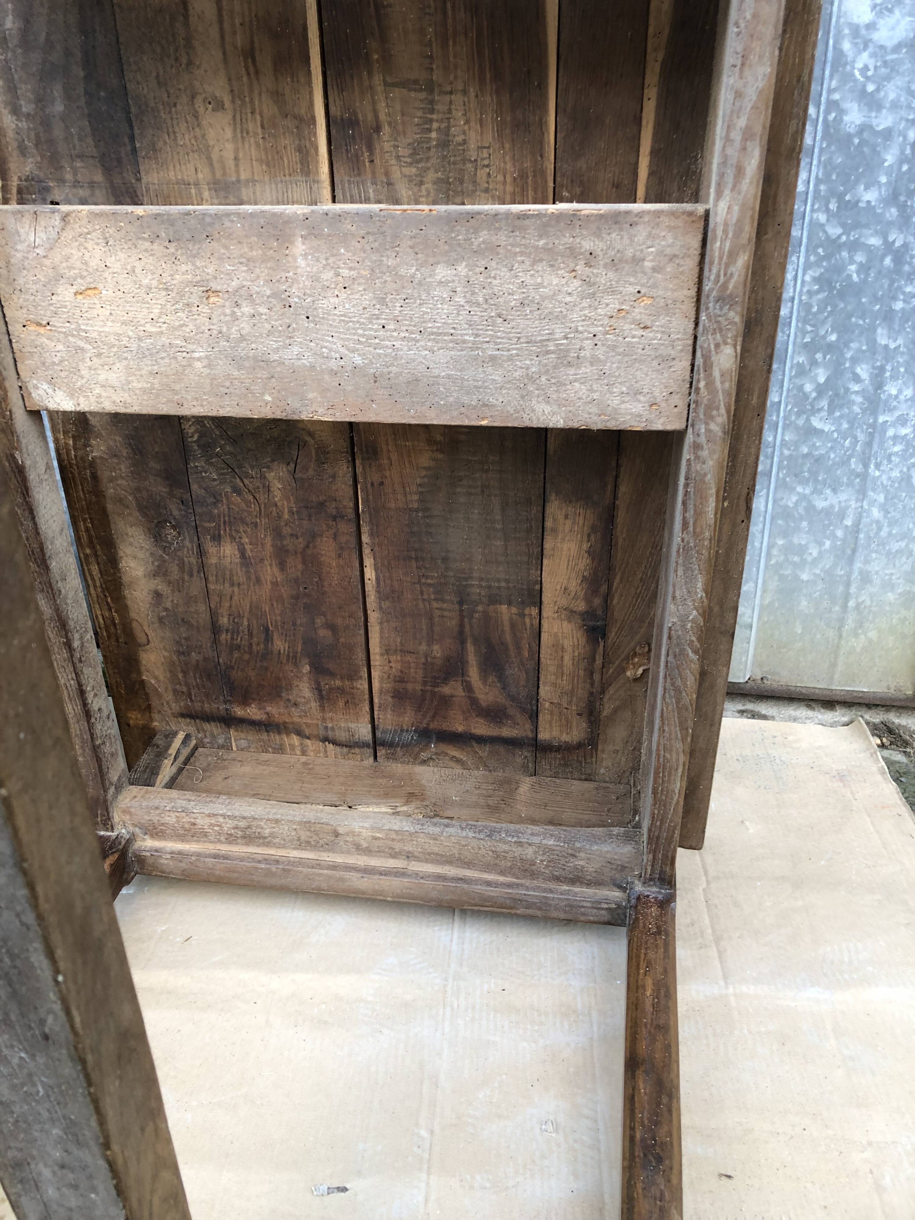 Old chestnut table with 3 front drawers and a cat bar.