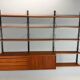 Modular wall shelf in teak in mid-century modern style, designed by Poul Cadovius for Cado, 1960.