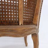 Louis XV style carved armchair with double sided cane work on the side panels
