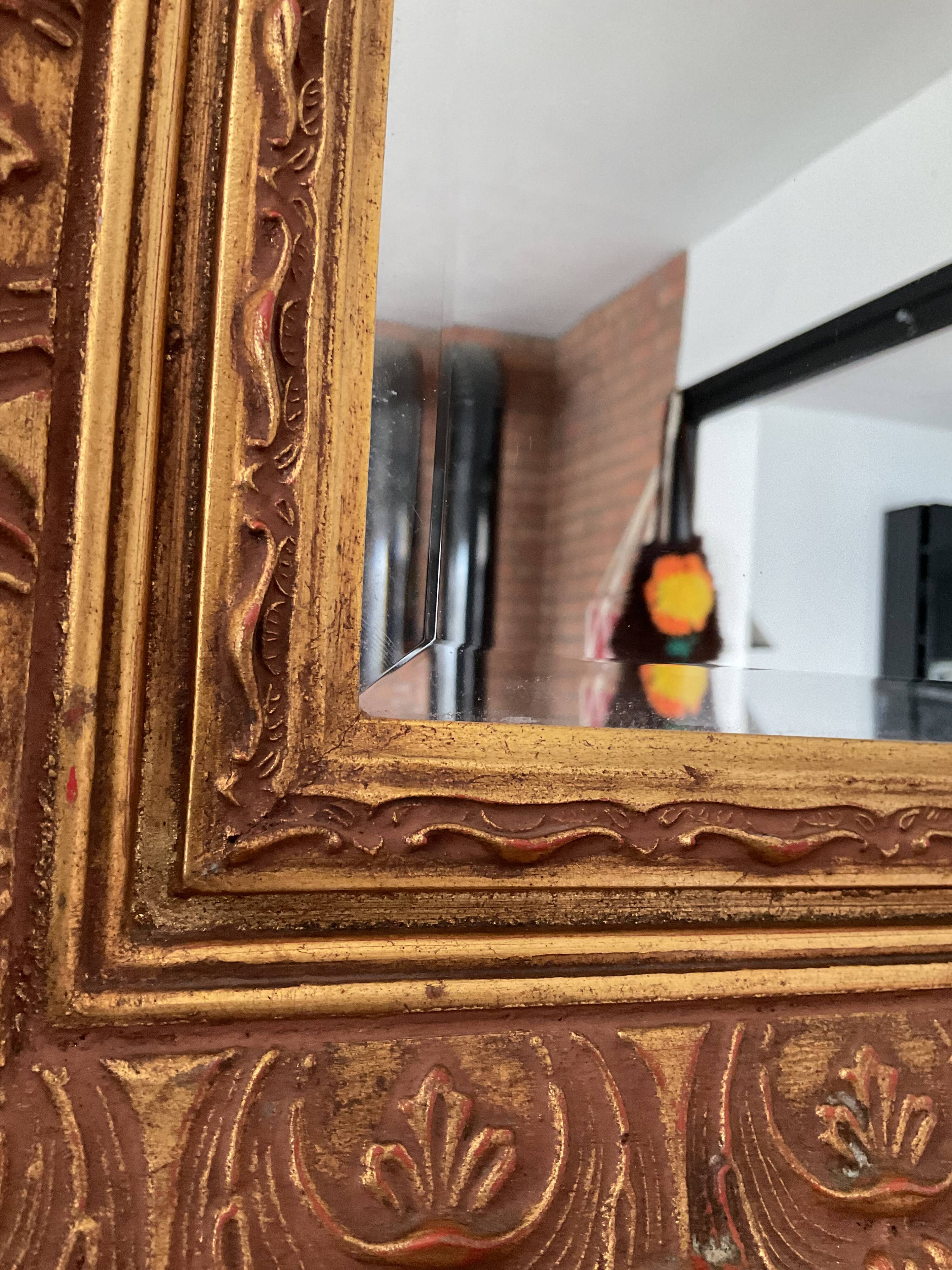 Old Beveled mirror in gilded wood