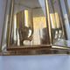 Pair of Italian gold-plated brass wall sconces with beveled glass