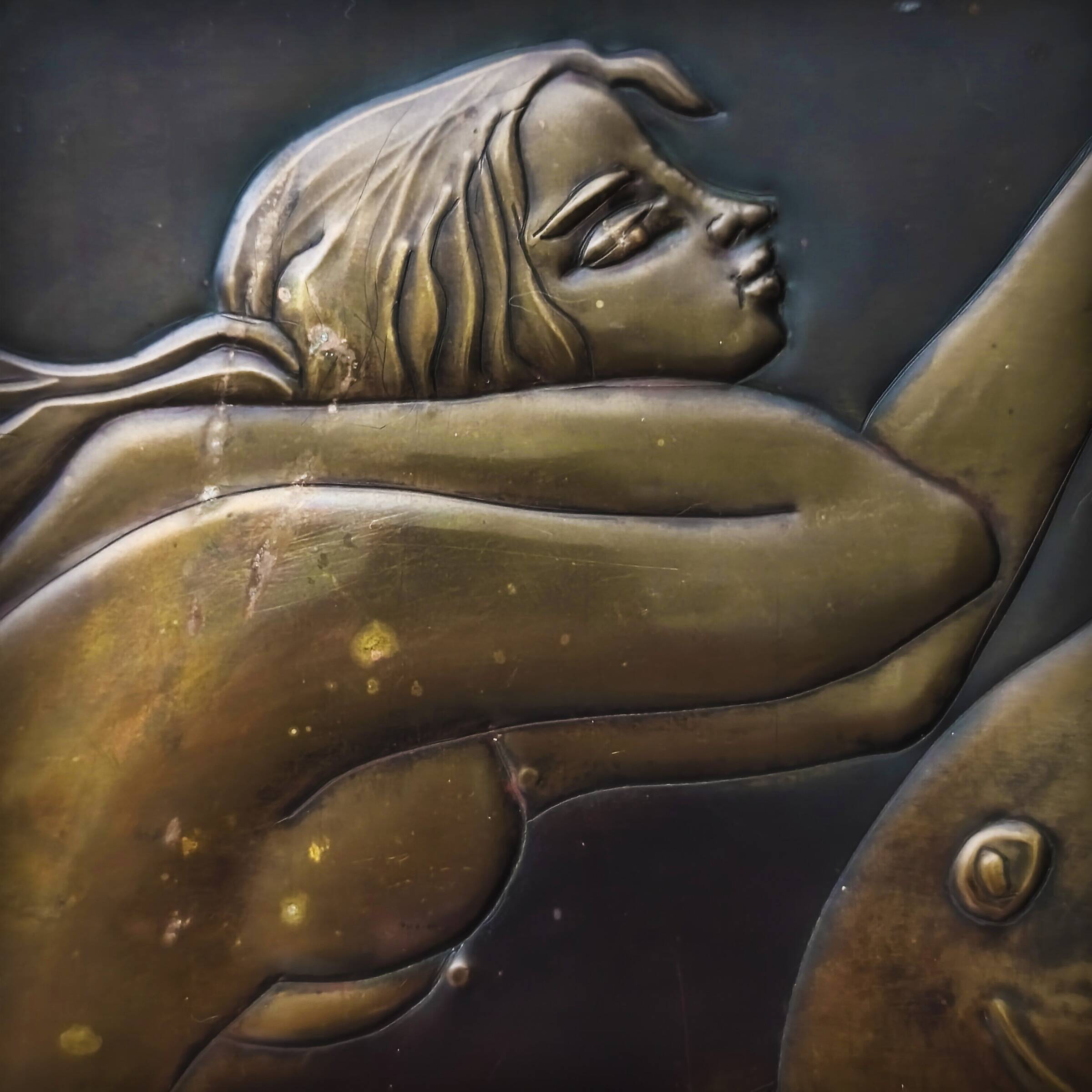 Brass table featuring a woman and a dolphin, France, 1960s.