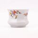 White porcelain pot (cache-pot) with floral patterns from Wunsiedel.