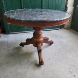 Round pedestal table with marble top and mahogany tripod from the 19th century