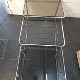 Nesting tables in chromed metal with smoked glass tops from the 1970s