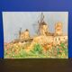 Watercolor landscape with vintage mills
