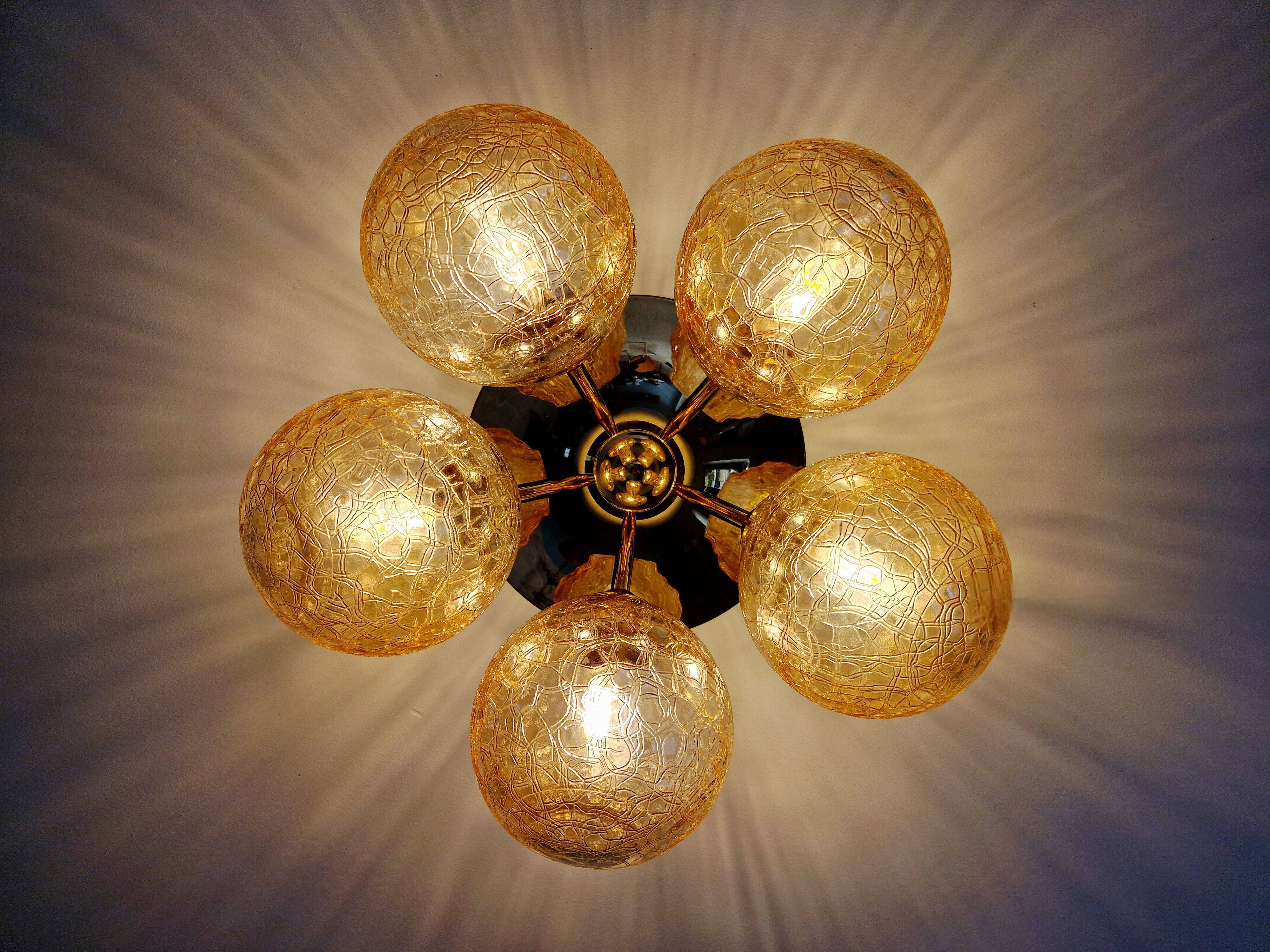 Large designer ceiling light in brass and amber crackled glass, 1970s.