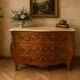 Curved Louis XV style commode with marquetry, opening with three drawers.