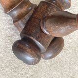 Wall-mounted accordion coat rack made of turned wood