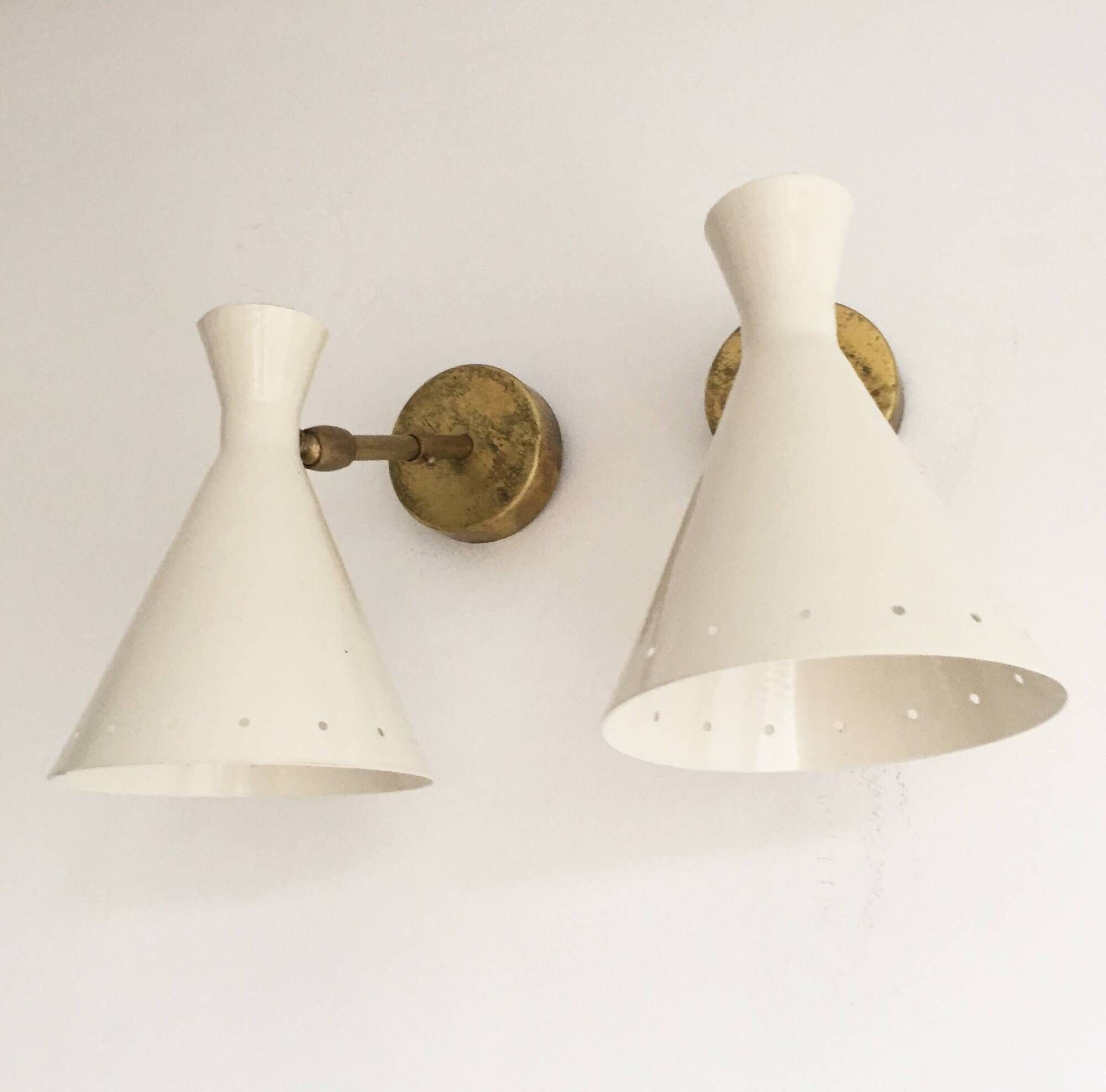 Pair of Italian wall sconces in brass and lacquered iron, 1950s design.