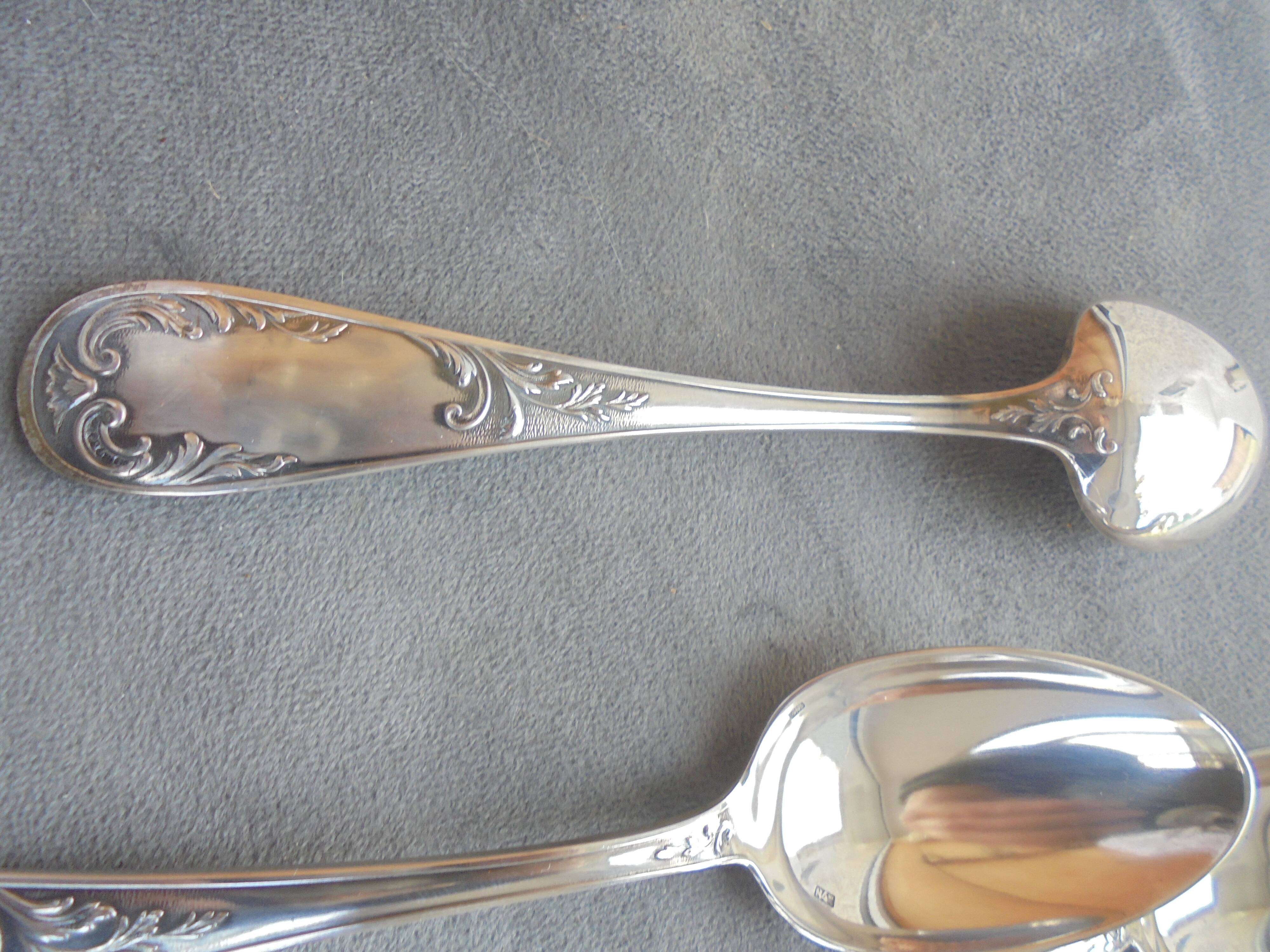 11 silver metal spoons