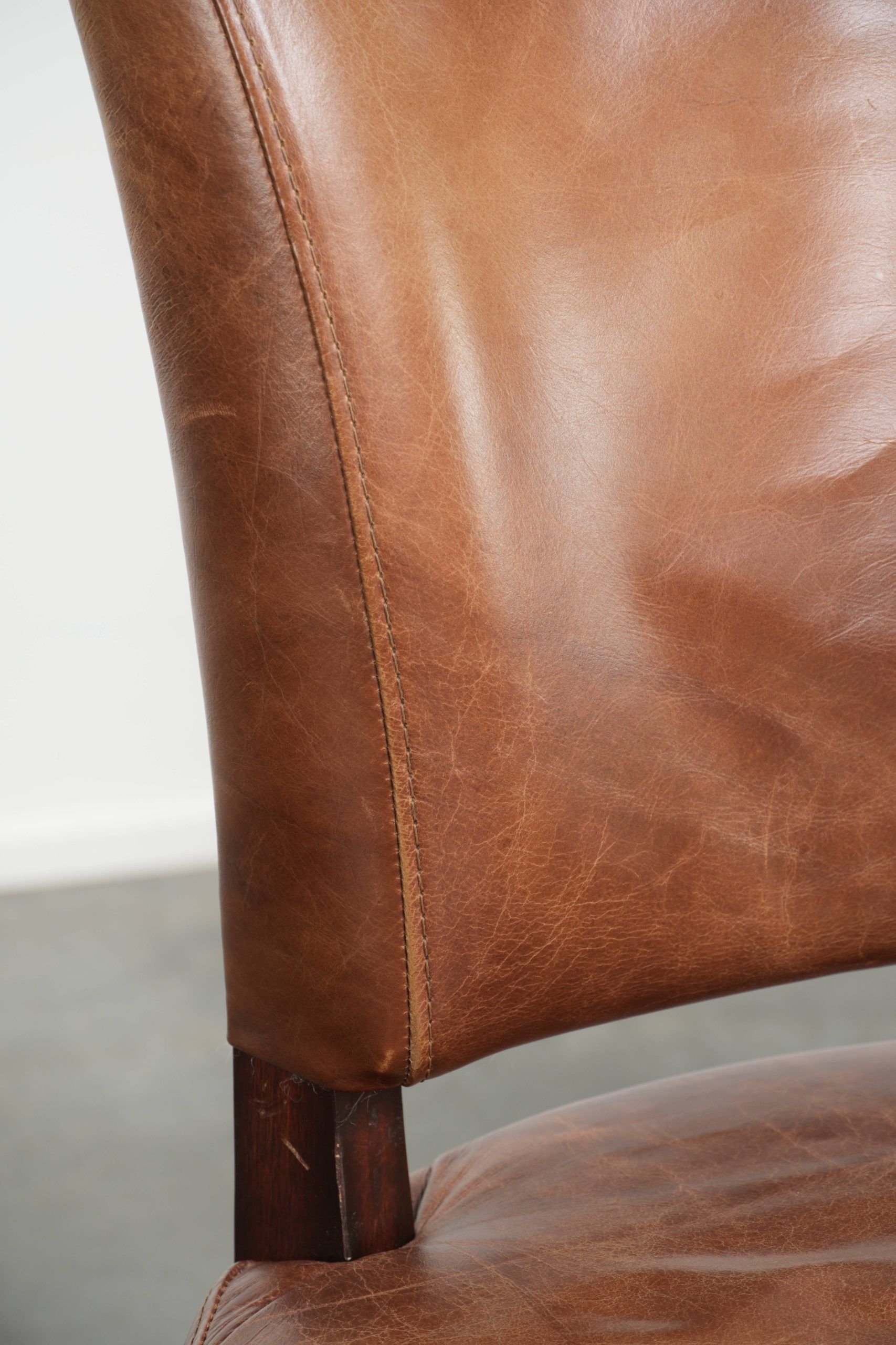 Set of 4 cognac-coloured cowleather dining chairs with decorative nails