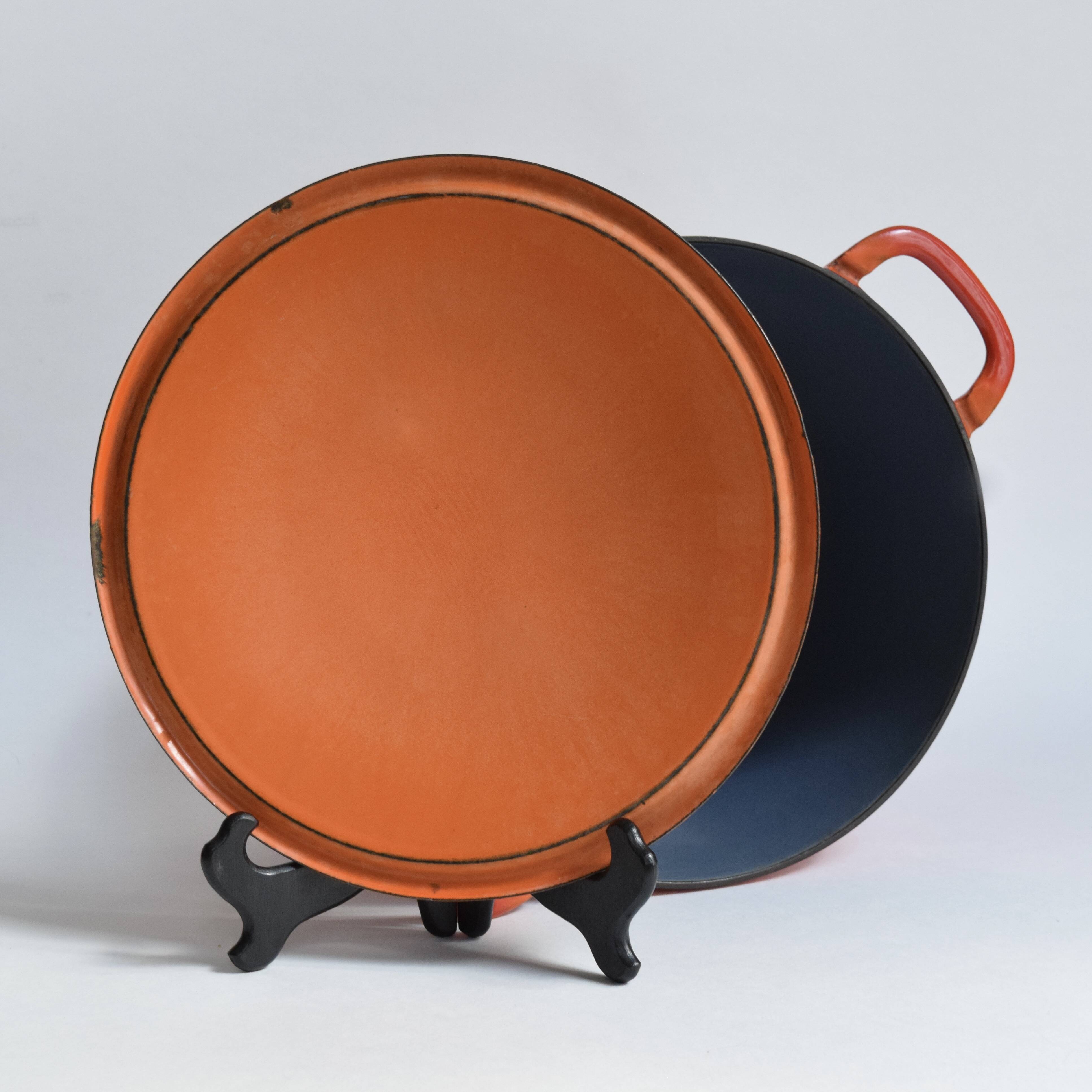 Large vintage saucepan or casserole dish in orange enameled cast iron