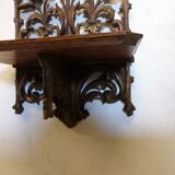 Carved wooden wall shelf