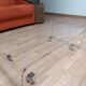 Design coffee table from Habitat in transparent plexiglass, mounted on wheels.