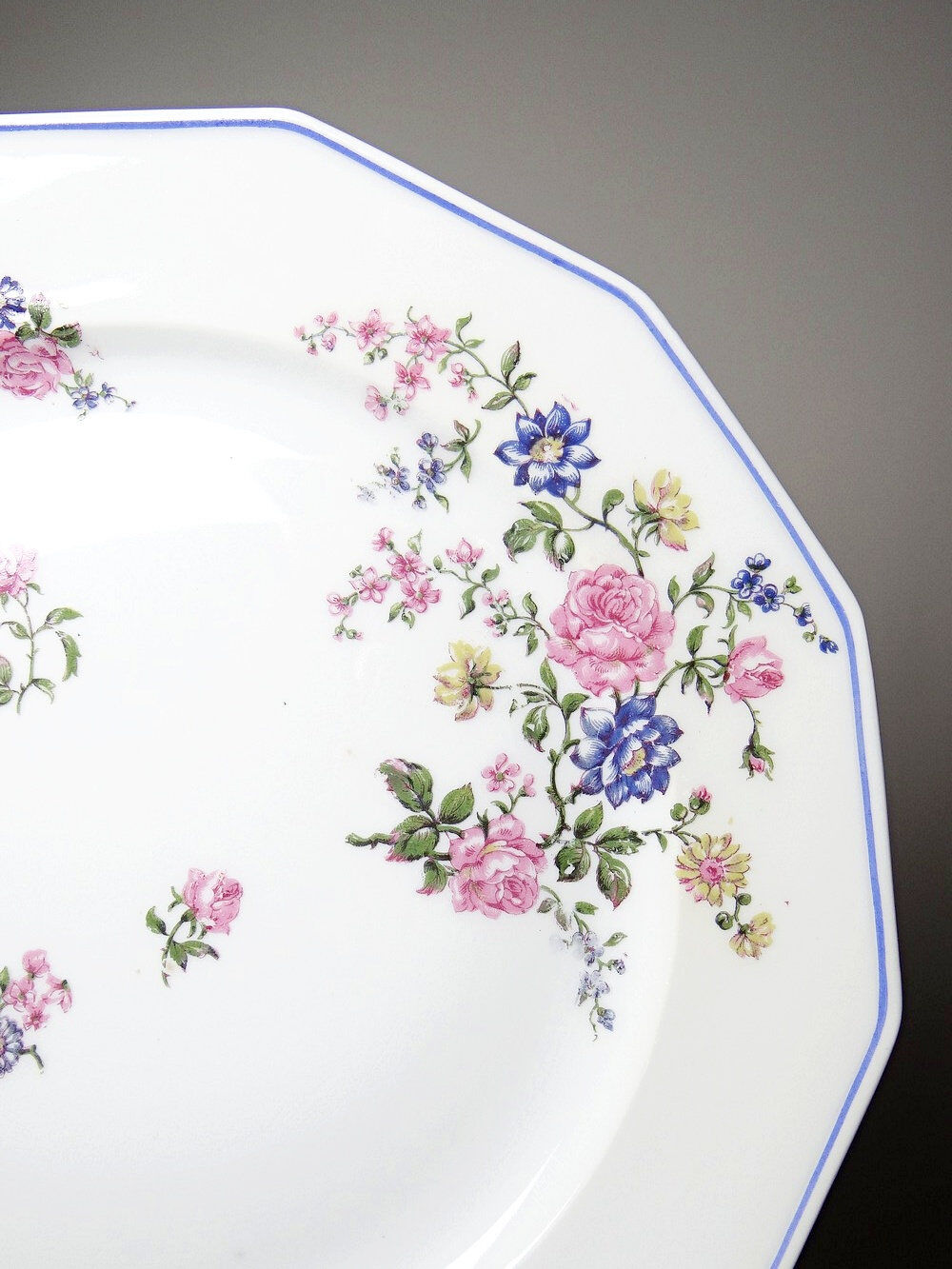 4 flat plates by Bernardaud, Limoges porcelain, floral decoration from the 1920s to 1950s.