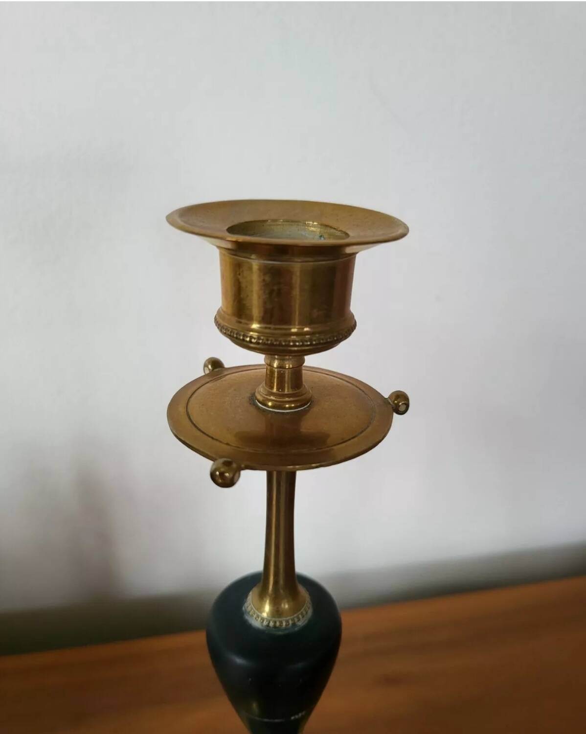 Pair of brass and black hard stone candlesticks