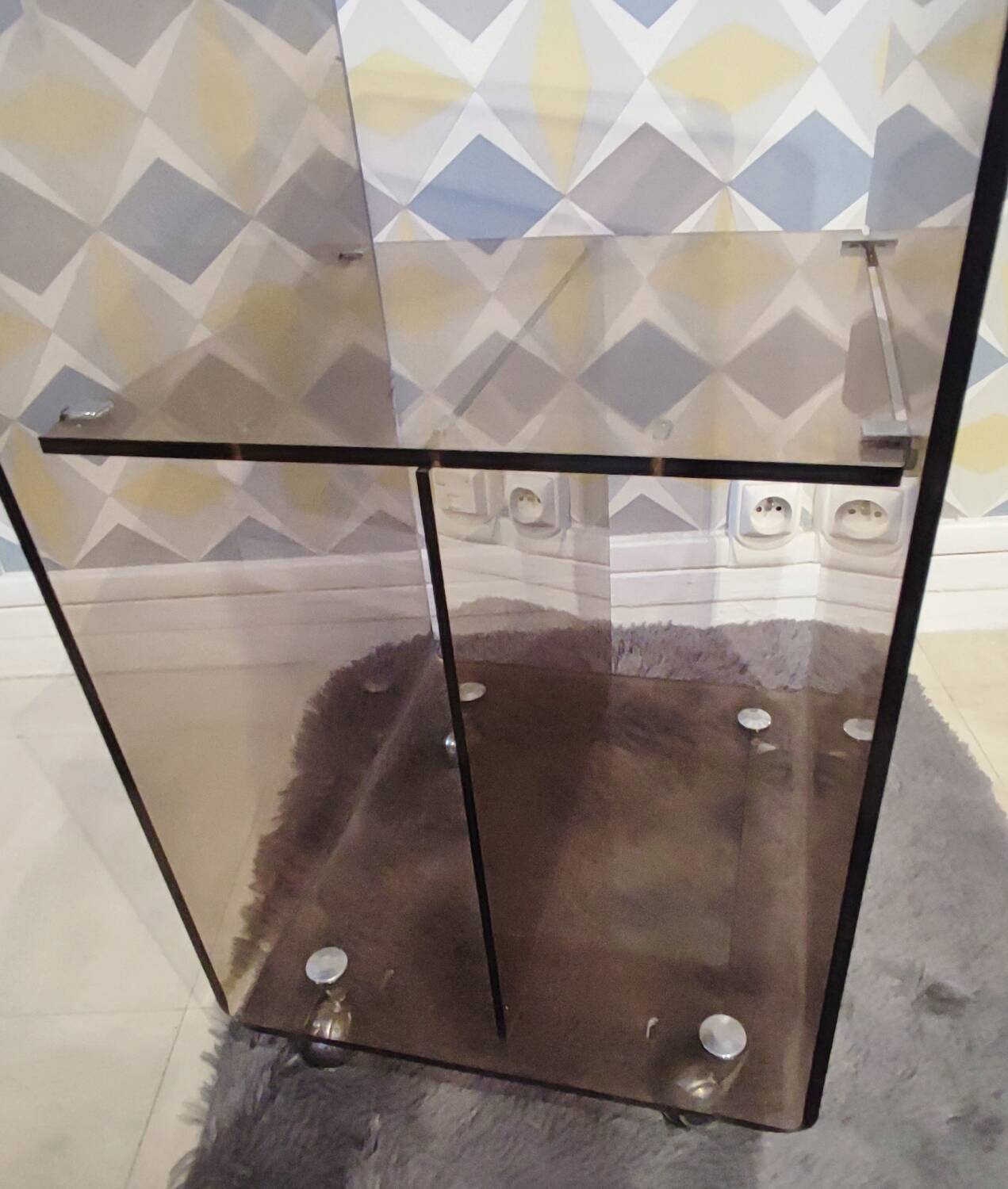 Michel Dumas smoked Plexiglas rolling table.