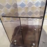 Michel Dumas smoked Plexiglas rolling table.