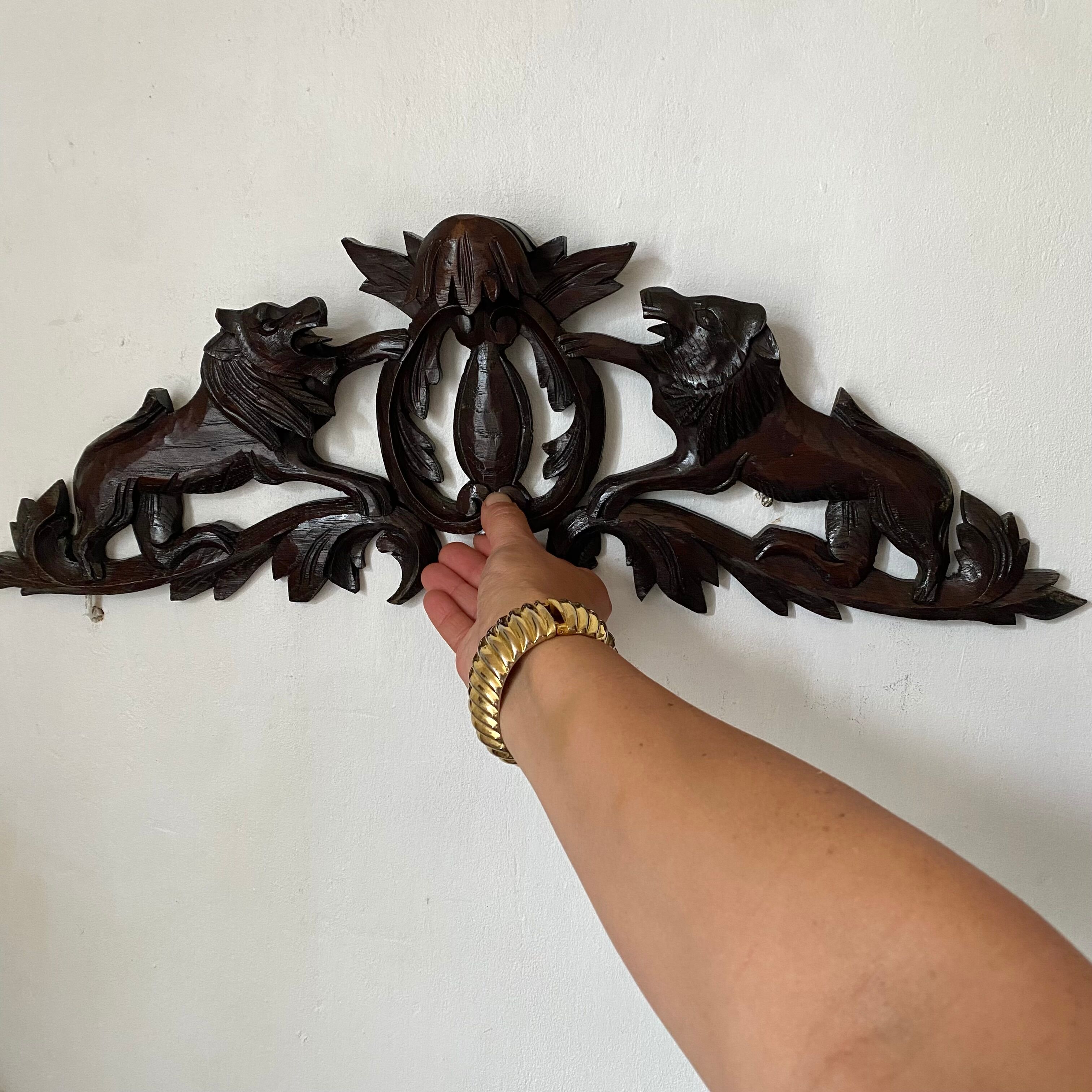 Antique carved wooden pediment with lions and medallion