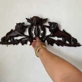 Antique carved wooden pediment with lions and medallion