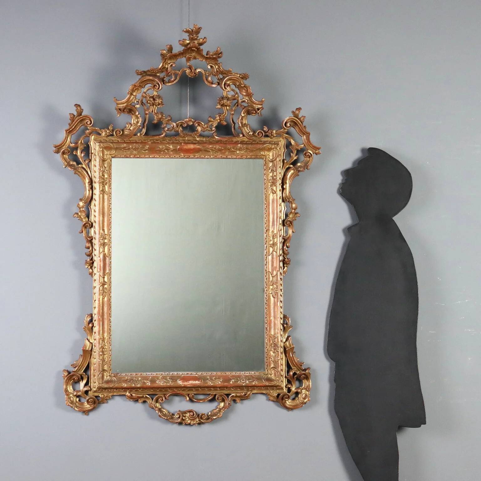 Antique carved and gilded wooden mirror, Italy, early 20th century.