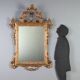 Antique carved and gilded wooden mirror, Italy, early 20th century.