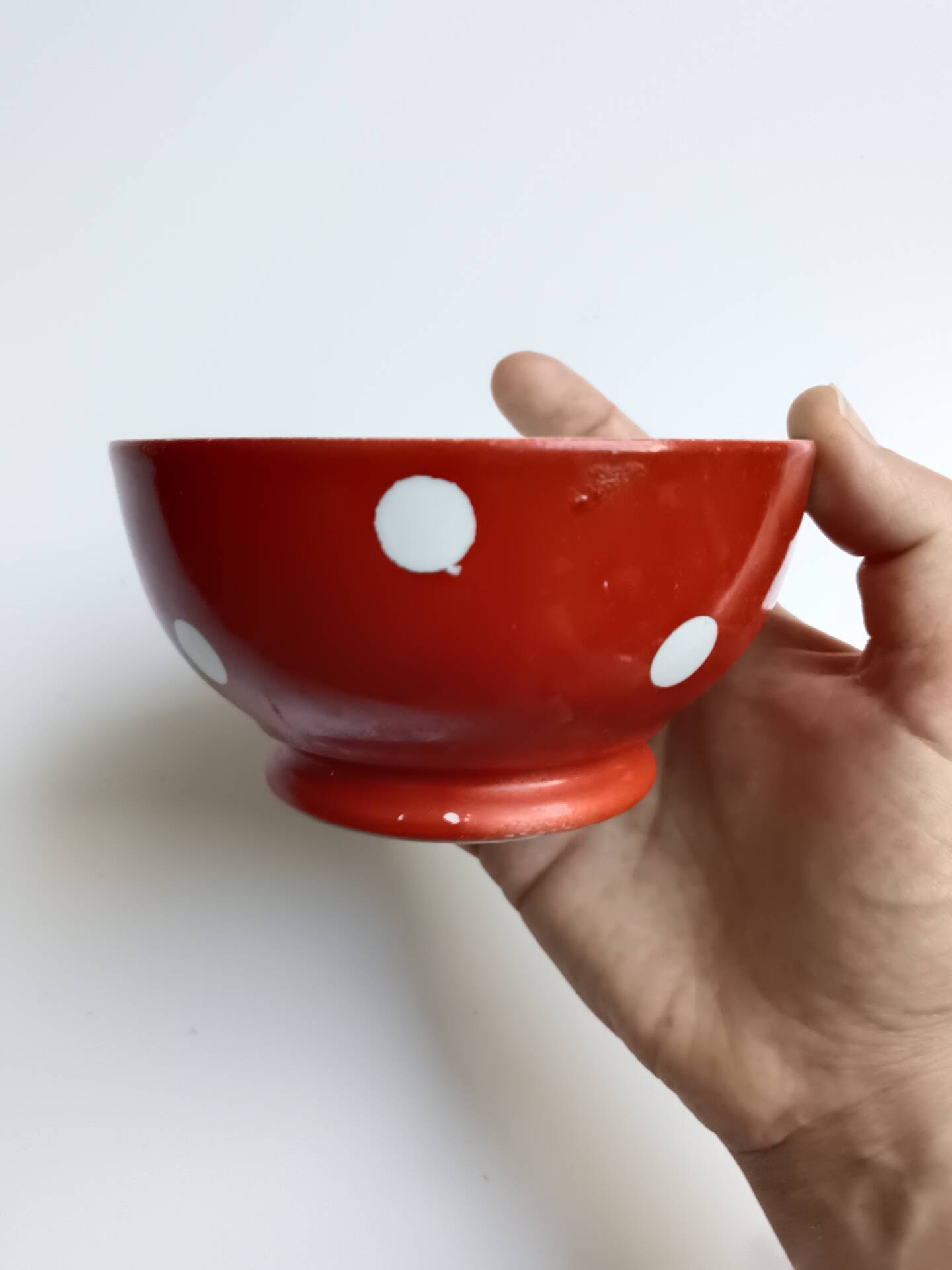 Red bowl with white polka dots in Longchamp ceramic