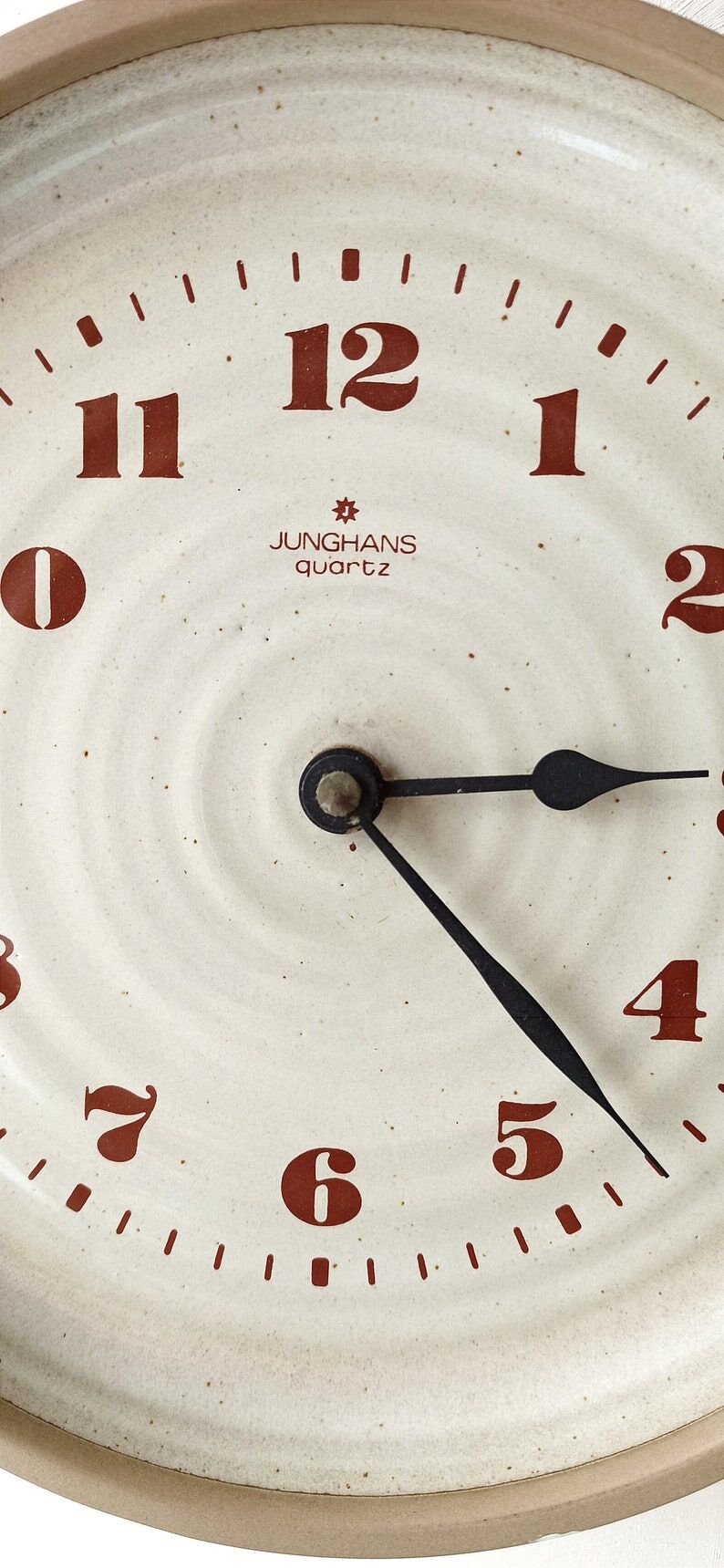 Clock in the shape of a round plate Junghans