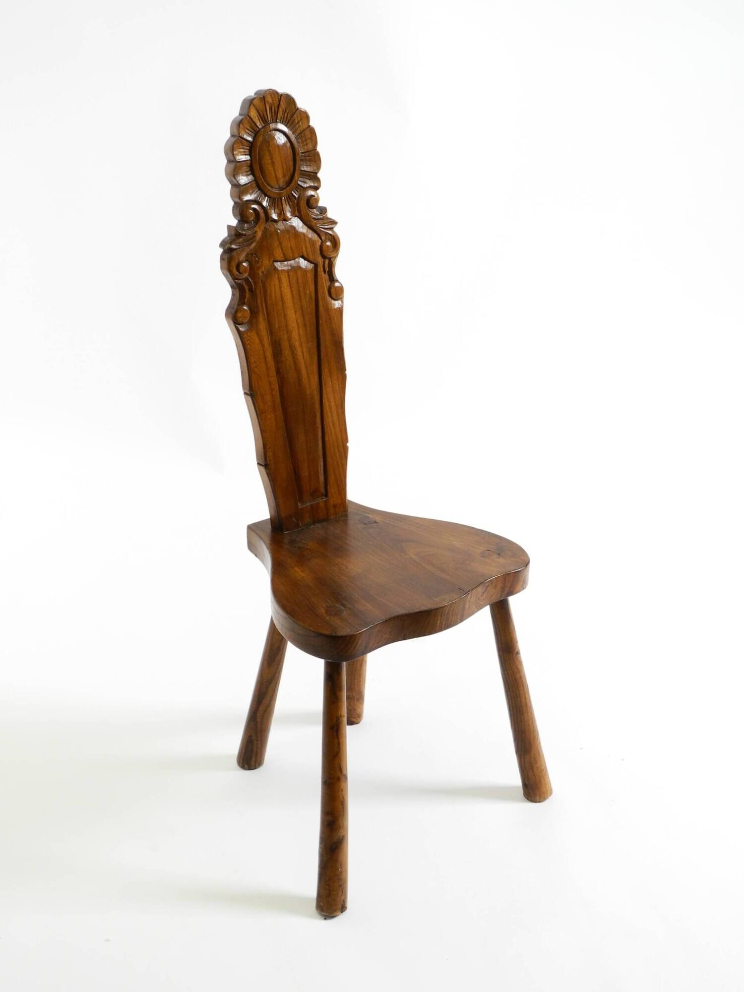 Solid wood chair with an ornate, hand-carved backrest – Made in Spain