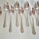 Dessert spoons, silver coffee spoons, small Baguette spoons.