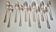 Dessert spoons, silver coffee spoons, small Baguette spoons.