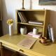 Desk table from the late 19th century, painted mustard, with turned stretcher.