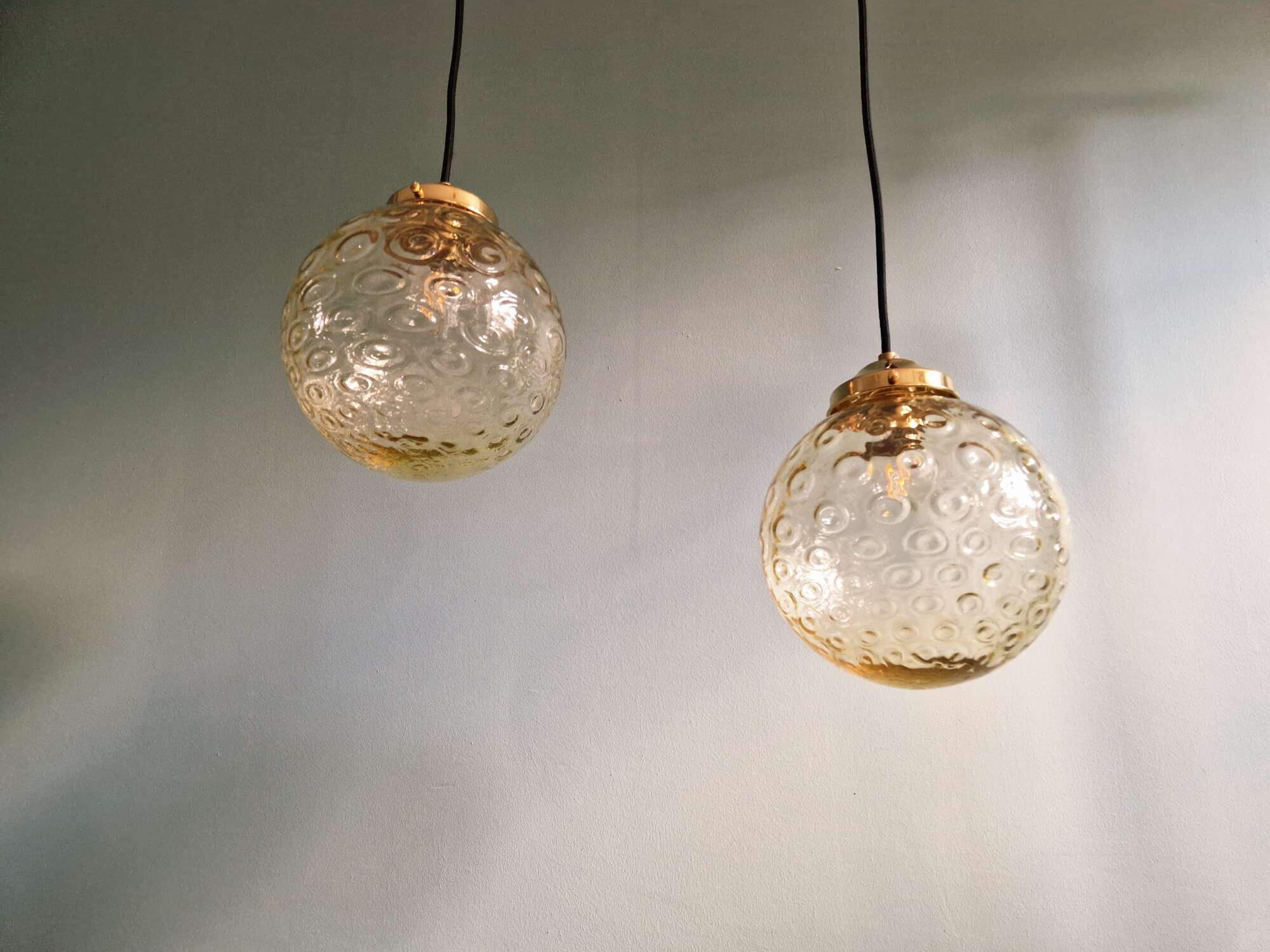 Pair of amber bubble glass pendant lights, 1970s