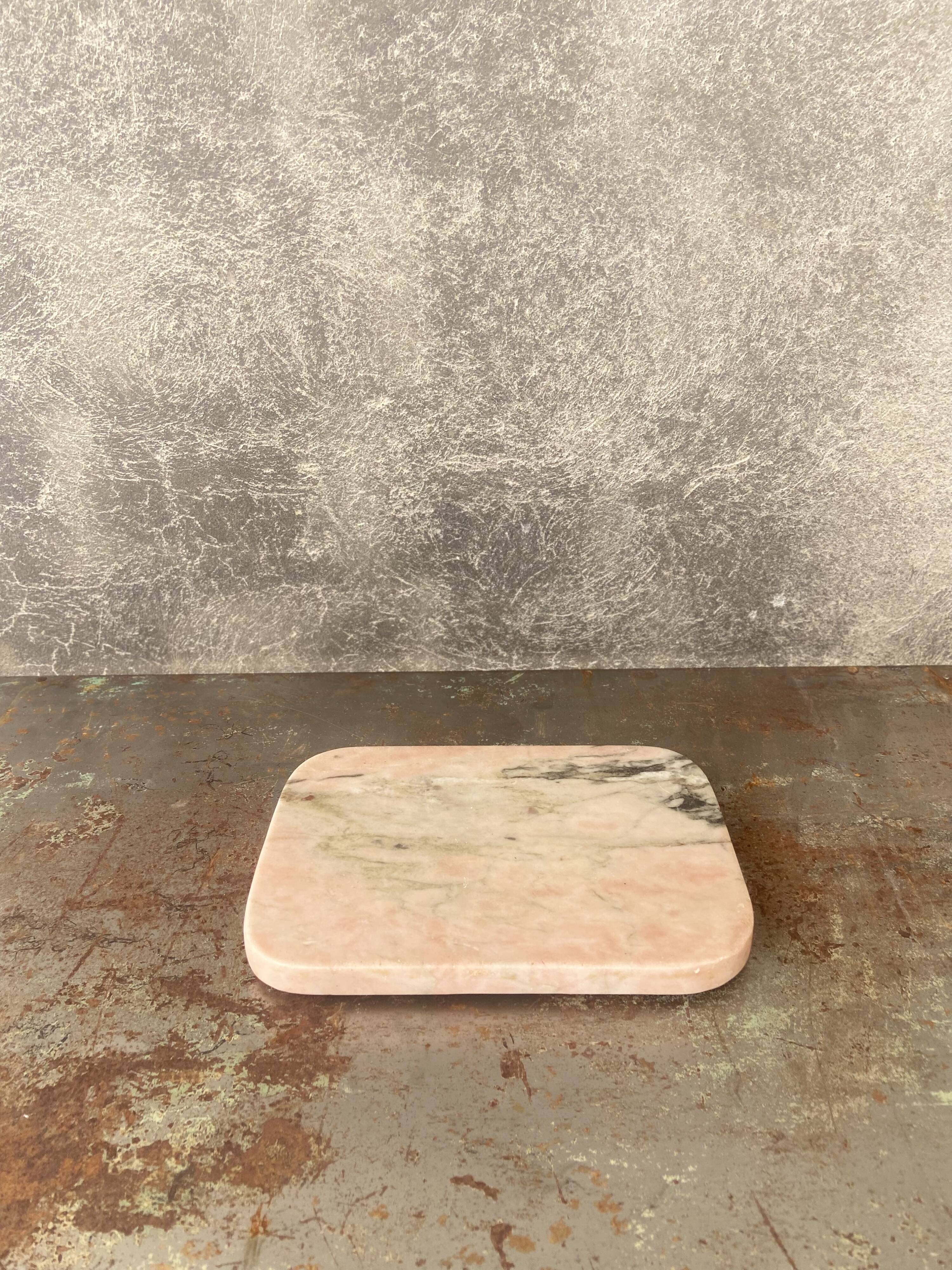 Cutting board in pink natural marble