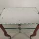 Glass art deco mirror beside table