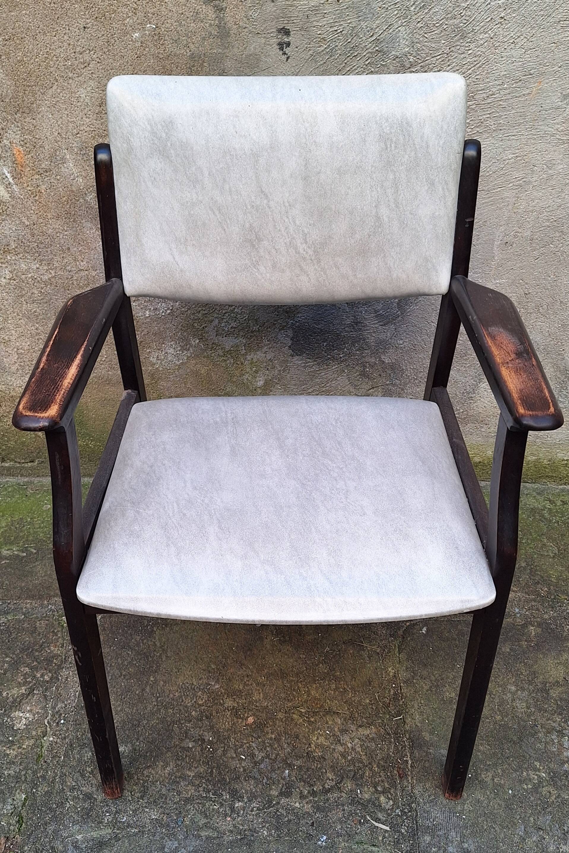 Wooden armchair and faux leather.