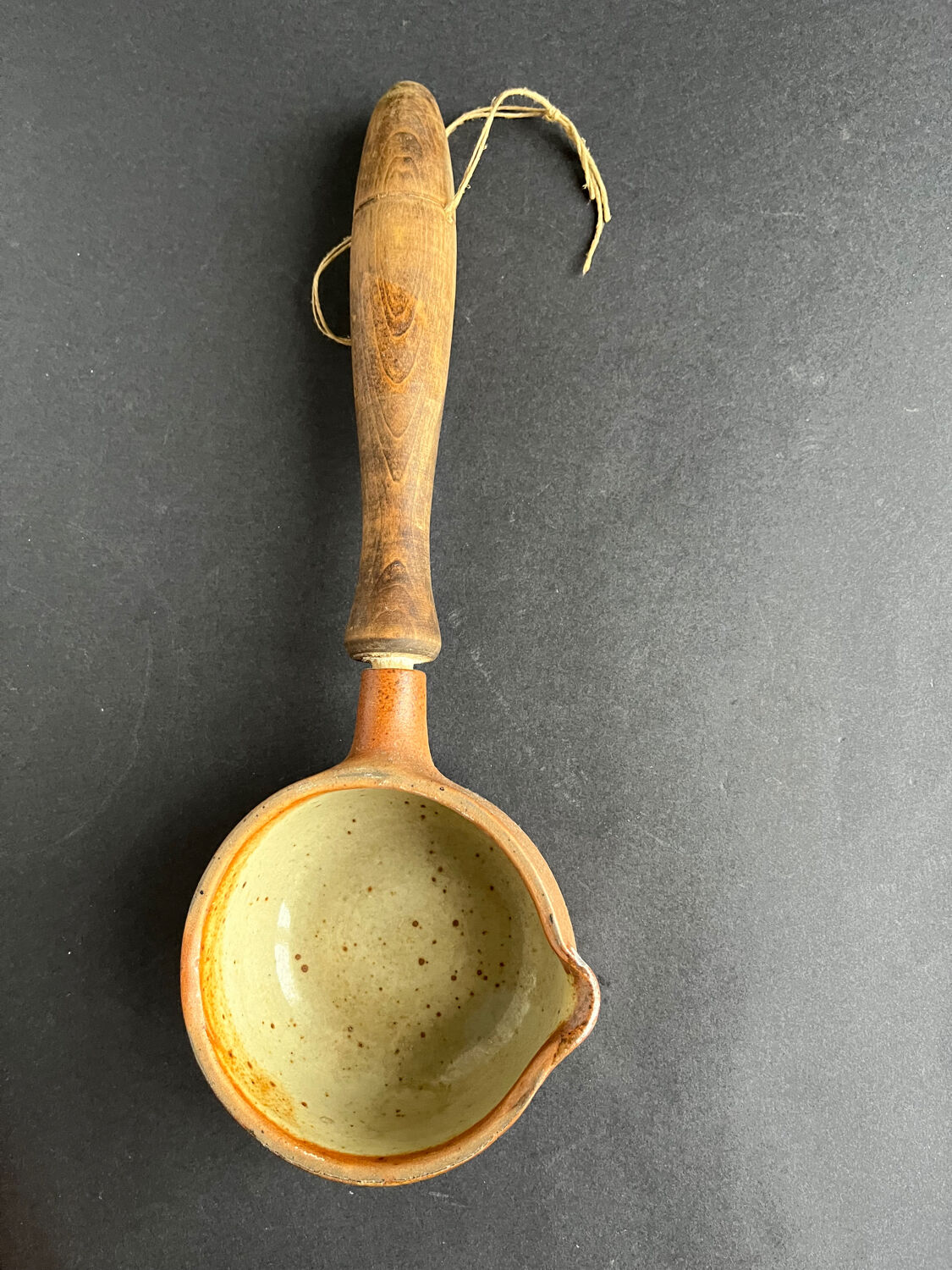 Ladle and sandstone strainer