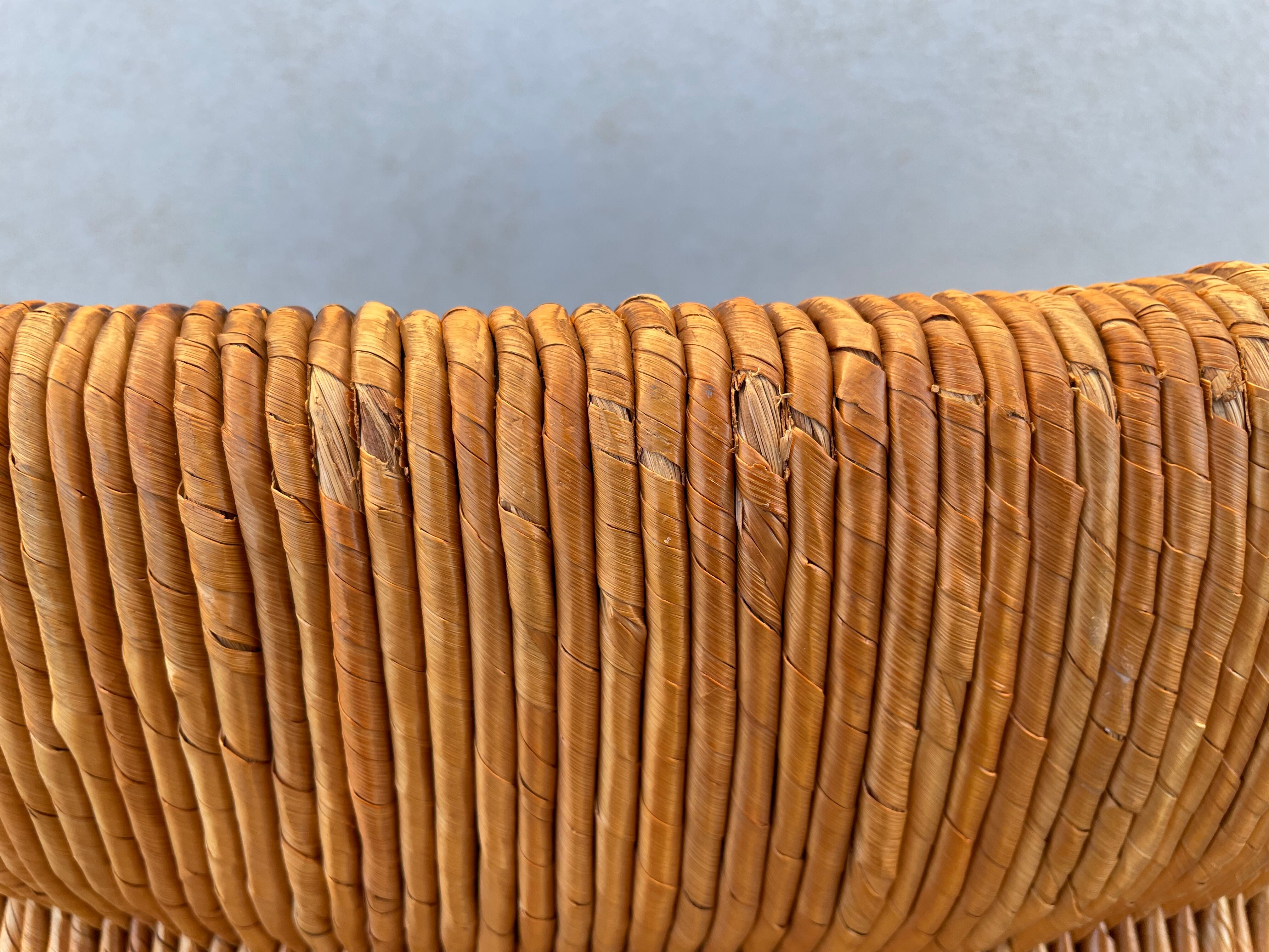 Vintage armchair in straw and brutalist wood