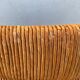 Vintage armchair in straw and brutalist wood
