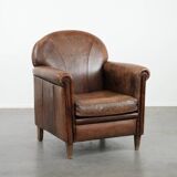 Beautiful vintage sheep leather armchair with a characterful appearance