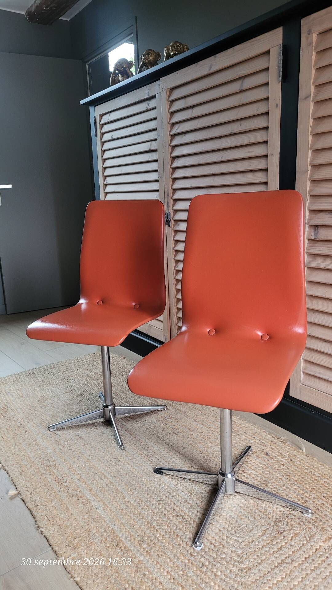 2 orange faux leather swivel chairs