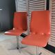 2 orange faux leather swivel chairs