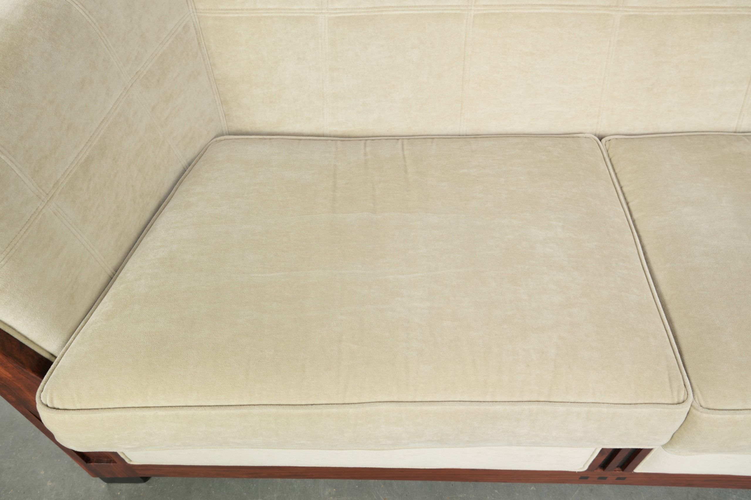 Art Deco design sofa with beautiful woodwork and cream fabric upholstery