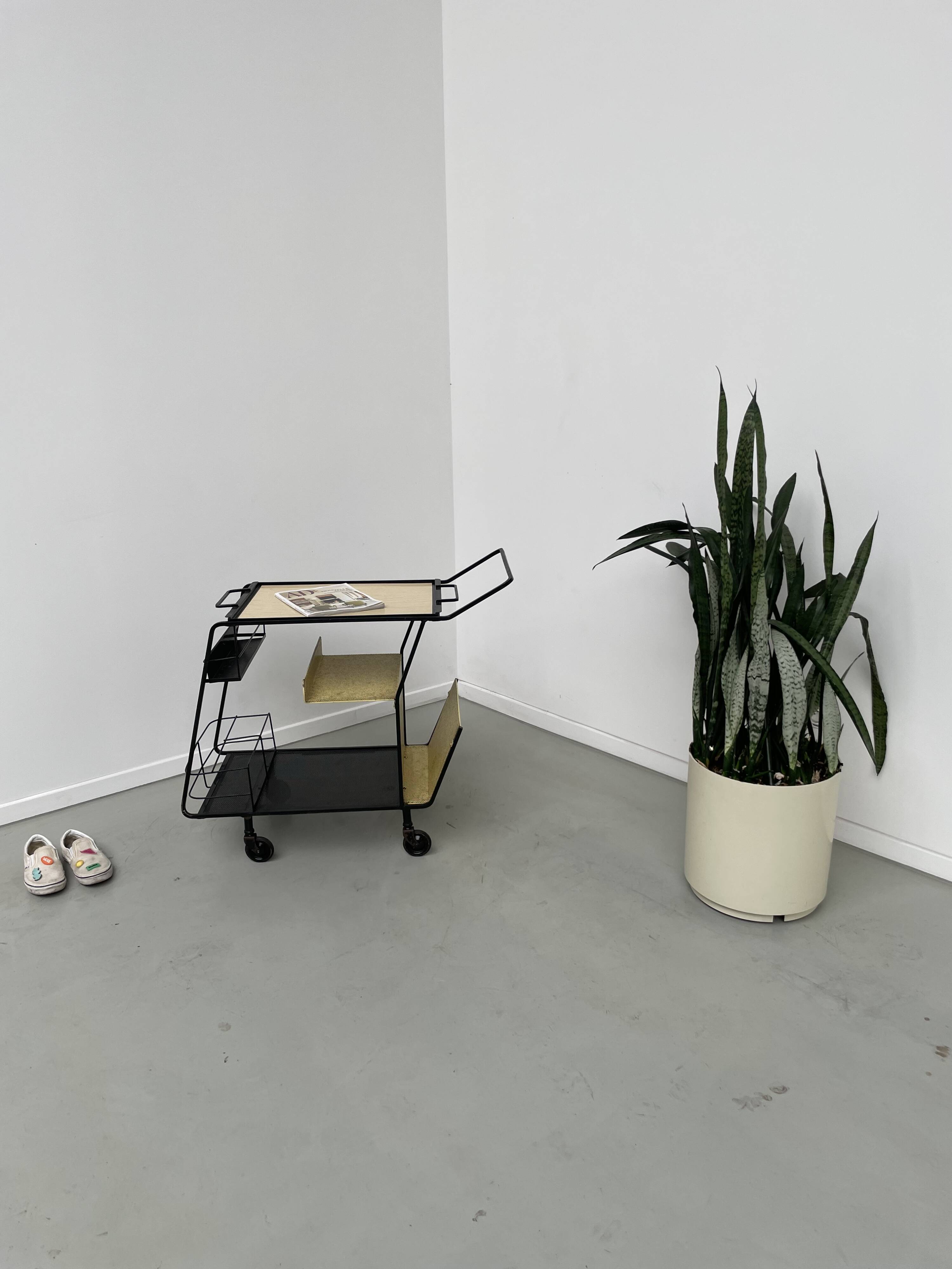 Perforated metal serving trolley in the Mathieu Matégot style