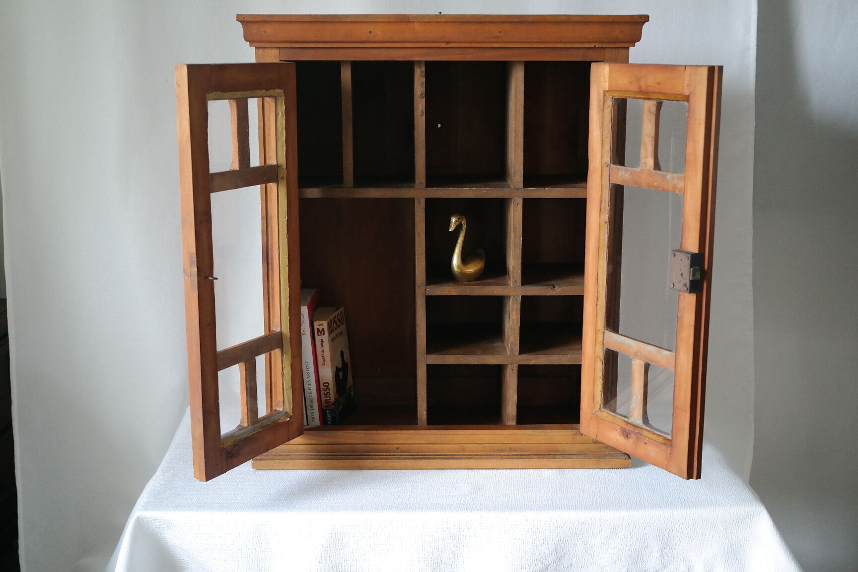 Antique walnut display cabinet from the 20th century.