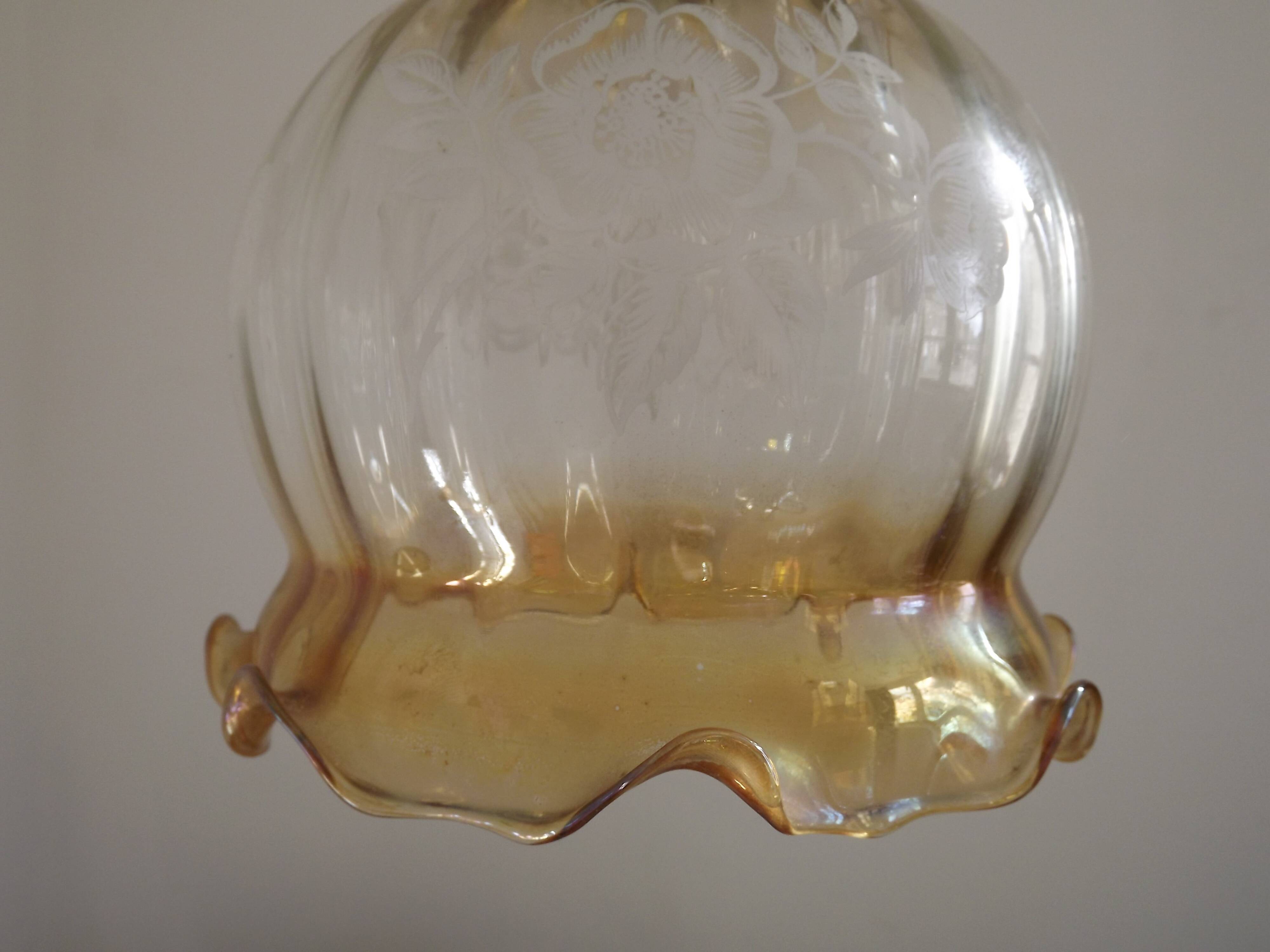 French vintage amber and clear glass ceiling light with white floral decoration.