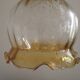 French vintage amber and clear glass ceiling light with white floral decoration.